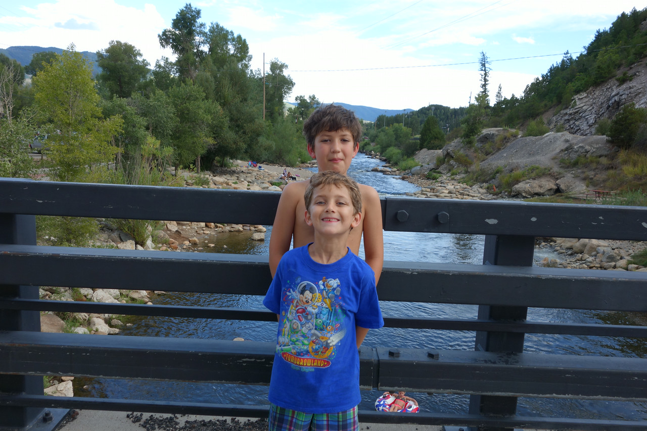 The boys standing over the Yampa River